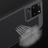 the back of a black samsung s9 with a smoke coming out