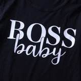 a black shirt with the word boss baby printed on it