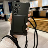 Black smartphone case with a card holder and a lanyard.