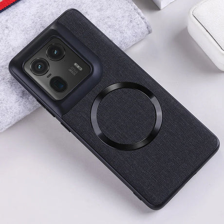 Black smartphone case with a textured back and a circular magnetic ring.