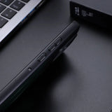 Black smartphone in a protective case with visible side buttons.