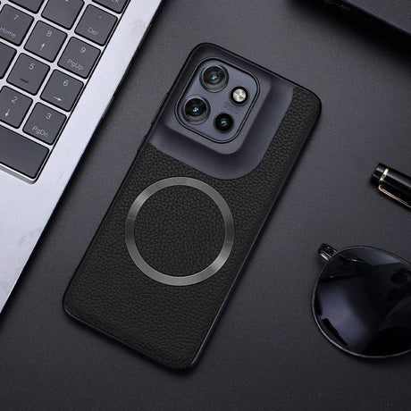 Black smartphone in a textured case with a prominent camera module and a magnetic ring.