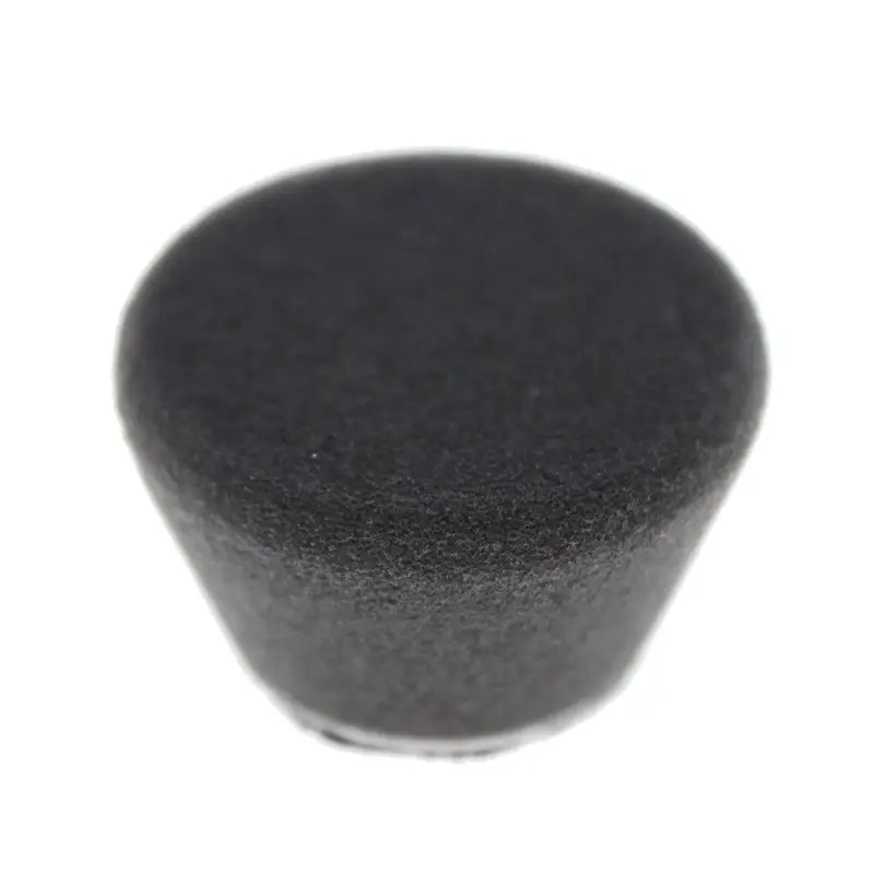a black sponge on a white background