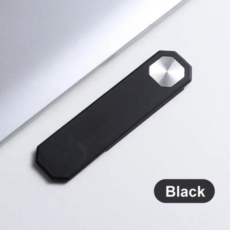 a black usb stick sitting on top of a laptop