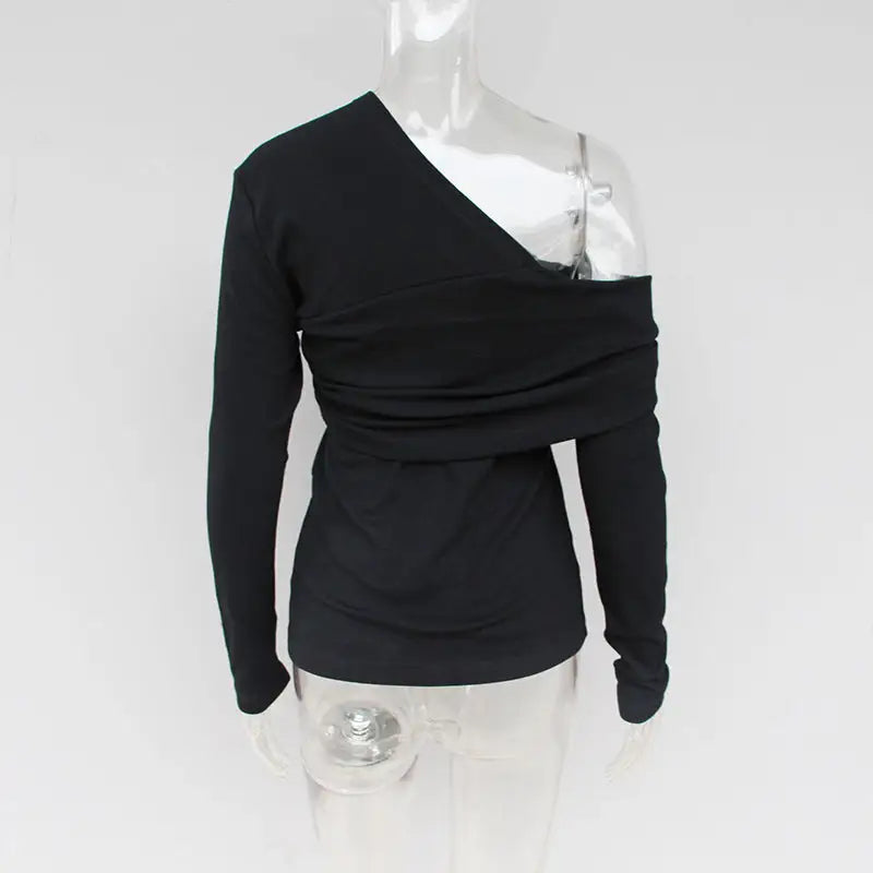 a black sweater with a shoulder and a shoulder band