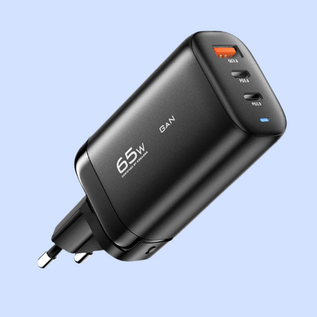 Black USB wall charger with multiple ports and 65W output capability.