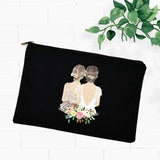 a black velvet makeup bag with a woman’s face and flowers