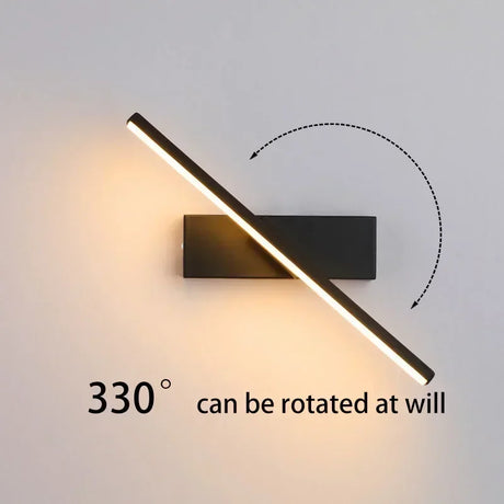 a black wall light with a white background