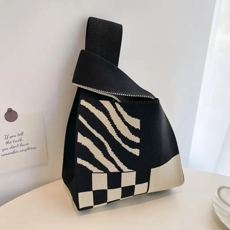 a black and white bag with a zebra print