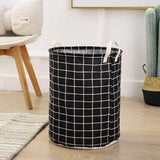 a black and white basket with a white grid pattern