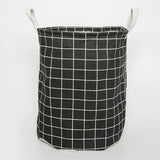 a black and white basket with a white grid pattern