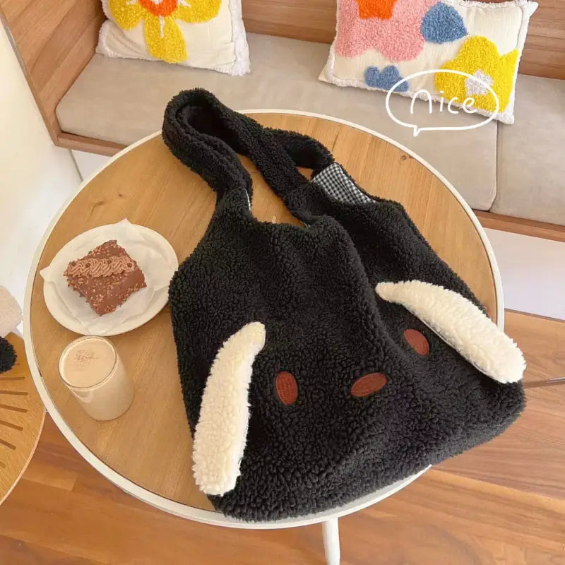 a black and white bunny hat sitting on a table