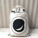 a white bag with a black and white design