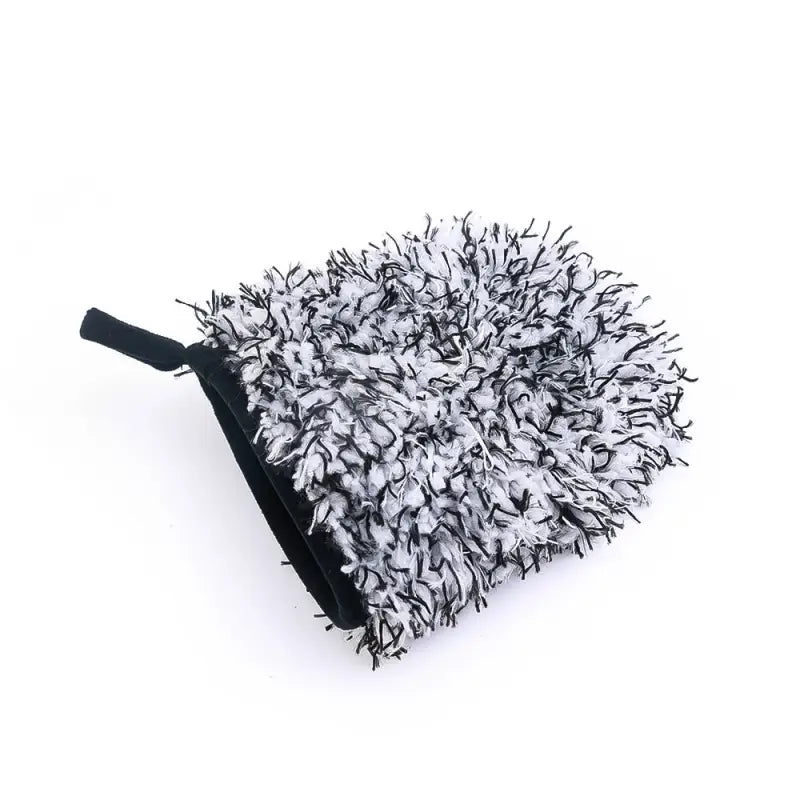 a black and white feathered heart shaped bag