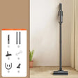 a black and white floor lamp with a plant in the background