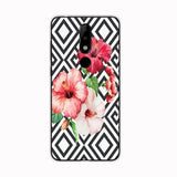 the pink flowers on black and white geometric pattern skin for motorola z3