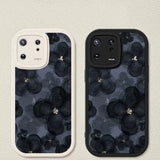 the black floral pattern on this phone case is perfect for all your phone