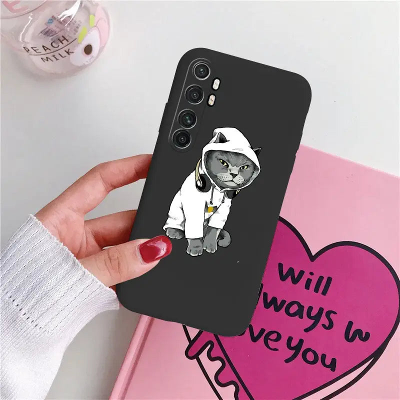 a black cat with a white hat and a heart phone case
