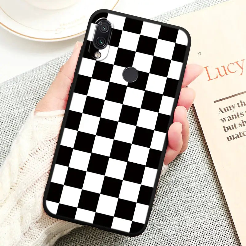 a black and white checker pattern on a white background