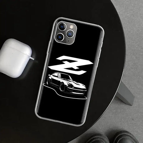 A black and white iphone case with a car on it