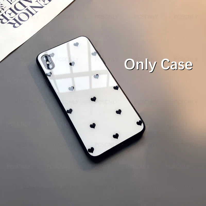 a black and white iphone case with hearts on it