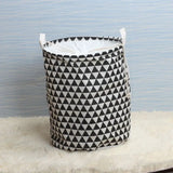 a black and white triangle pattern laundry basket