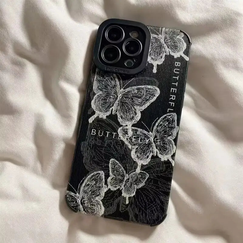a black and white phone case with a floral design