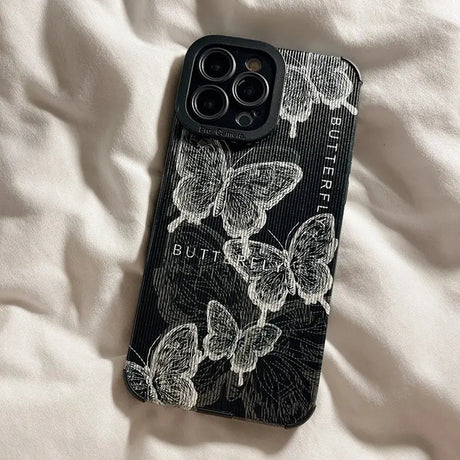 A black and white phone case with a floral design