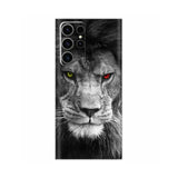 a black and white photo of a lion with red eyes