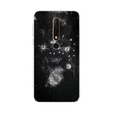 a black and white photo of a phone case with a space scene