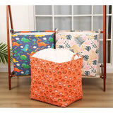 three colorful storage bags on a wooden chair