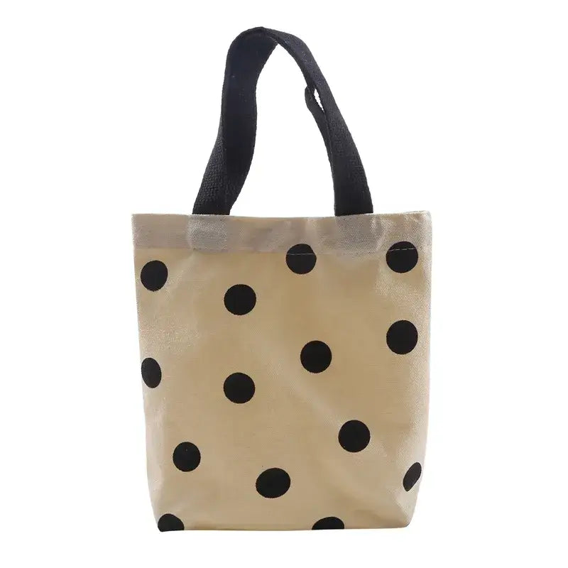 a black and white polka dot tote bag