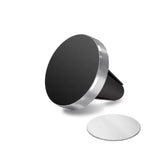 a black and white phone stand with a round mirror