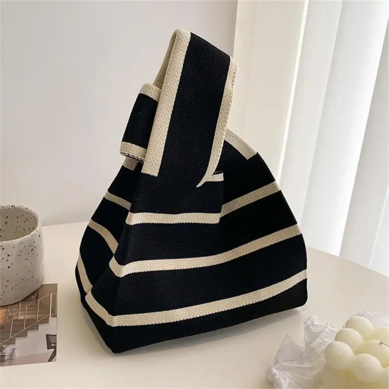 a black and white striped bag sitting on a table