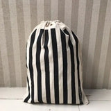 a black and white striped bag sitting on a table