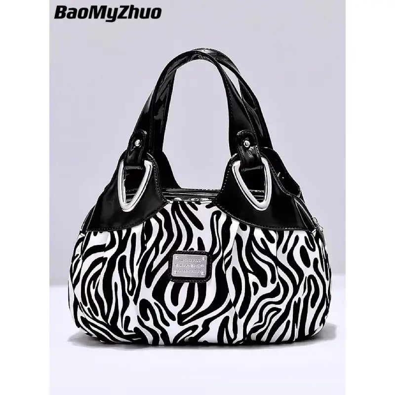 a black and white zebra print bag