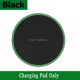 a black wireless charger with a green glow on it