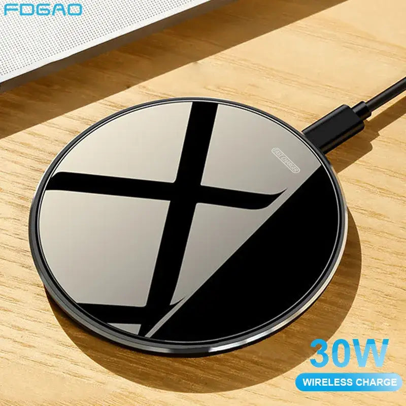 a black wireless charger on a wooden table