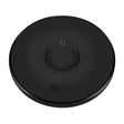 A black wireless charging dock with a smile on it