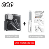 Black wireless earbuds with cleaning pen.
