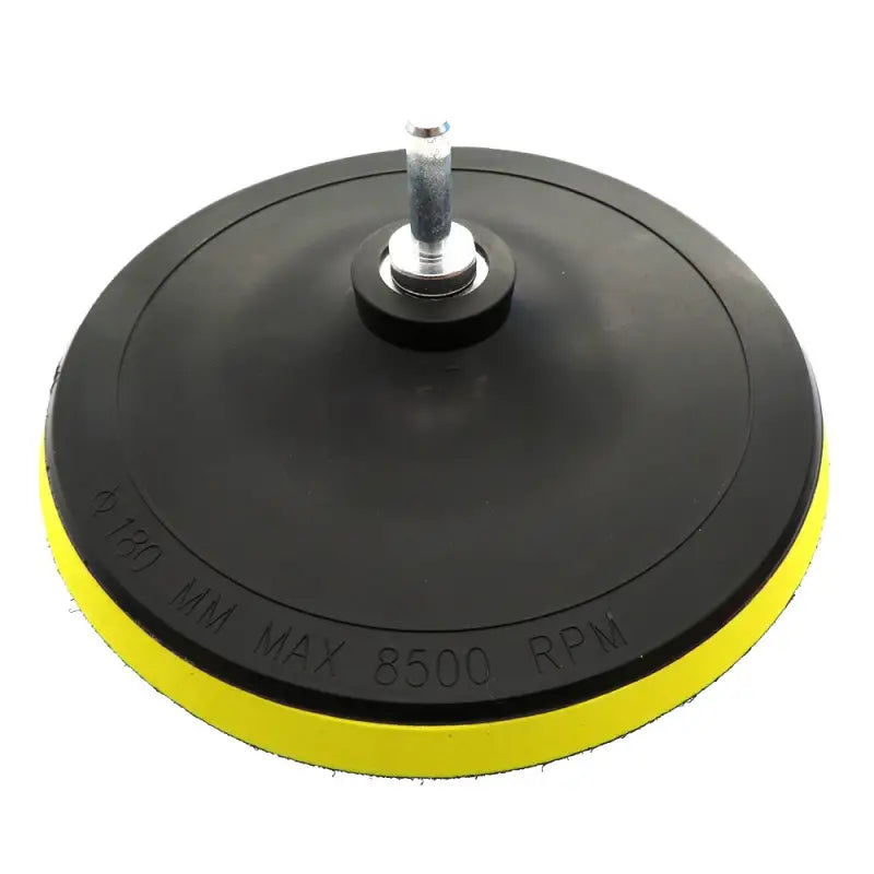a black and yellow disc with a white background