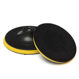 a black and yellow polish pad with a black disc