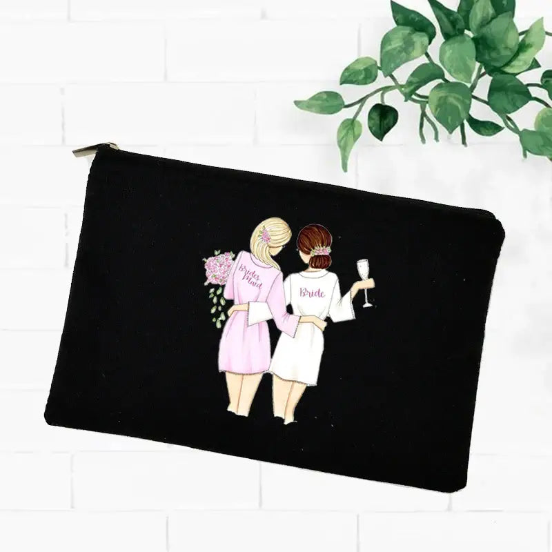 a black zipper bag with a drawing of two women in pink dresses