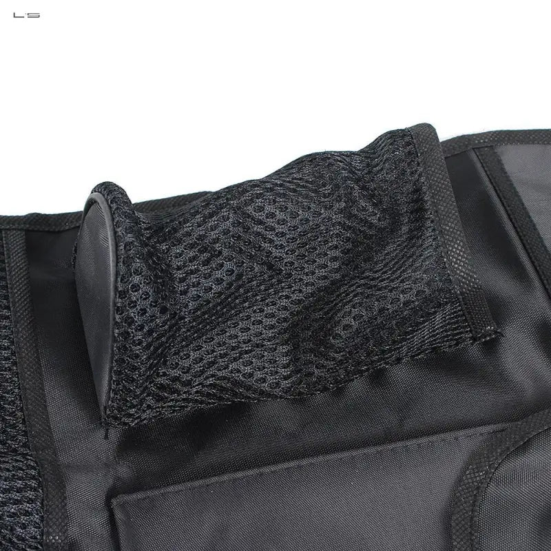 the back of a black backpack with a mesh pocket