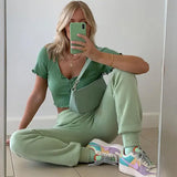 blond woman sitting on the floor taking a selfie with her phone
