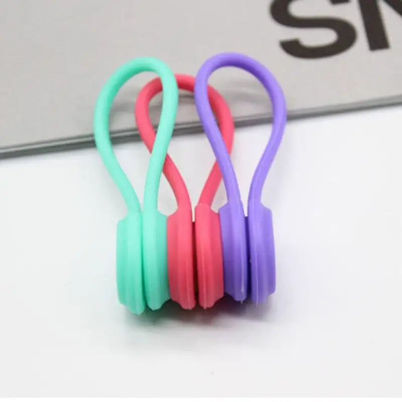 a pair of colorful earphones on a white surface
