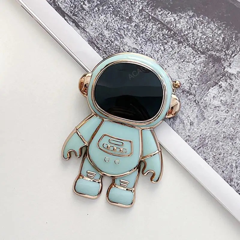 a blue astronaut pin with a black eye