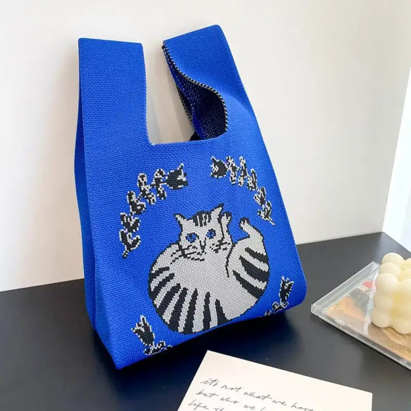 a blue bag with a cat on it