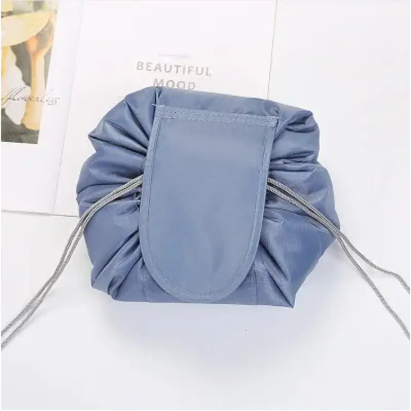 a blue bag with a draws on the bottom