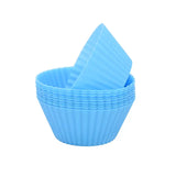 a blue baking cup with a paper liner